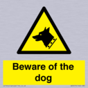 beware-of-the-dog-with-dog-warning-symbol~